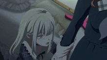 a girl in a school uniform is standing in front of a white dresser