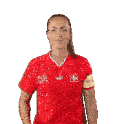 a woman wearing a red puma shirt with a swiss cross