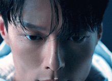 a close up of a man 's face with a watermark that says ' a ' on the bottom