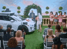 a bride and groom are walking down the aisle at a wedding ceremony