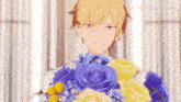 a man is holding a bouquet of blue and yellow flowers