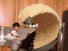 a man is cooking a large amount of rice in a kitchen with the word let above him