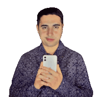 a man in a purple shirt holds a white iphone in his hands