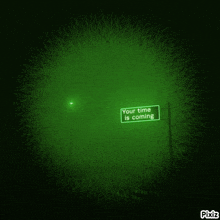a green sign that says your time is coming on it