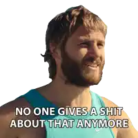 a man with a beard is wearing a blue nike tank top and says no one gives a shit about that anymore