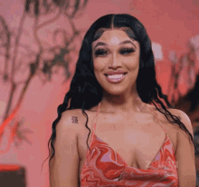 a woman has a tattoo on her shoulder that says ' 強 '