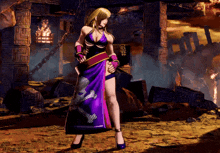 a woman in a purple dress is holding a sword in a video game