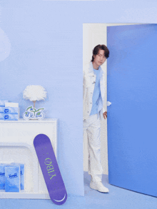 a person standing next to a skateboard that says vibo