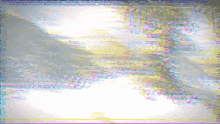 a blurry picture of a river with trees in the foreground