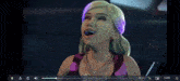 a video of a woman with purple hair is being played on a computer