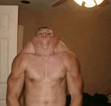 a man without a shirt has a huge neck