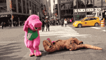 a t-rex is laying on the ground in front of a building that says levis