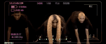 a video of a woman and two men is being recorded on a camera