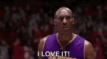 a basketball player is holding his hand to his ear and saying i love it .