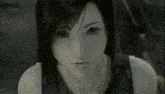 a close up of a woman 's face with dark hair