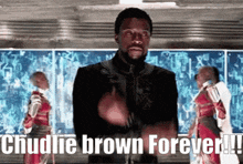 a man is standing in front of a screen that says chullie brown forever !!!
