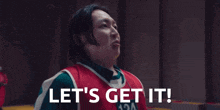 a man in a basketball uniform says let 's get it ..