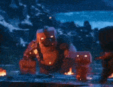 a giant monster standing next to a smaller monster in a video game .