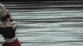 a blurry picture of a person walking on a gray surface