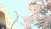 a girl in a bikini is holding a hose in her hand