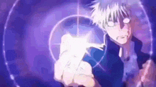 a person is holding a light in their hand in a purple background .
