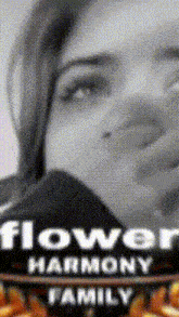 a black and white photo of a woman with the words flower harmony family