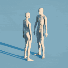 a couple of mannequins standing next to each other with flowers on them