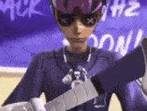 a cartoon character wearing a purple shirt and goggles is holding a sword .