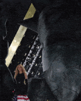 a woman in a black dress is holding an american flag in front of a statue of liberty