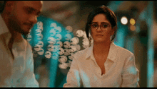 a man and a woman are looking at each other