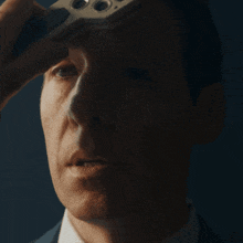 a close up of a man 's face with a device on his head