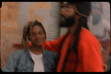 a blurry picture of a man in a red jacket