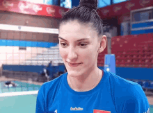 a woman wearing a blue shirt that says boskotica