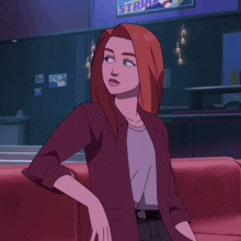a woman with red hair stands in front of a sign that says ' stark ' on it
