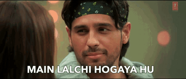 a man with a bandana on his head and the words main lalchi hogaya hu