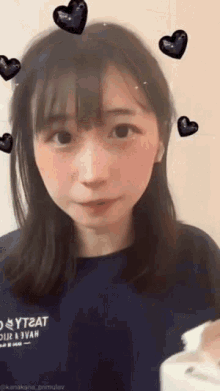 a girl wearing a blue shirt that says yt2at on it