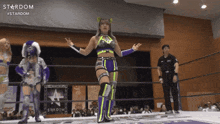 a woman in a wrestling ring with stardom written on the bottom