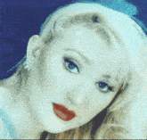 a close up of a woman 's face with red lips