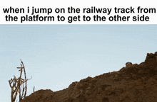 a man standing on top of a pile of dirt with the caption when i jump on the railway track from the platform
