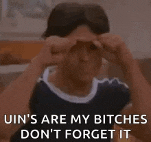 a man is giving the middle finger and saying `` uin 's are my bitches don 't forget it ''