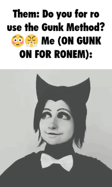 a black and white photo of a person with a cat costume