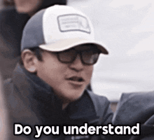 a man wearing a hat and glasses is asking do you understand