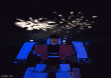 a robot with fireworks behind it and the url imgflip.com at the bottom