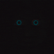 a close up of a person 's eyes that are glowing