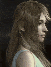 a woman with long blonde hair and a white tank top