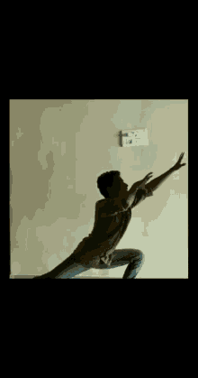 a man is giving a thumbs up to another man in a room