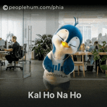 a penguin mascot is wearing a shirt that says peoplehum on it