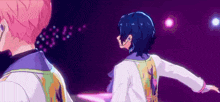 a couple of anime characters are standing next to each other on a stage with their arms outstretched .