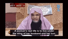 a man in a head scarf is talking about a woman 's real life being under the wing of her husband and her son