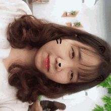 a close up of a girl 's face with a smiley face drawn on it